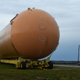 An engineering marvel next to an abandoned shuttle fuel tank.